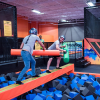 Battle Beam - Think Balance beam plus sward fighting Urban Air Trampoline Park Urban Air Trampoline Park Battle Beam - Think Balance beam plus sward fighting