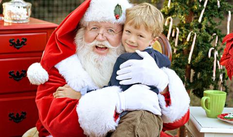 Best Location for Holiday Pictures with Santa Little Boy getting his picture with Santa Claus