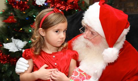 Santa Pictures in Nashville and Middle Tennessee Little girl getting Picture with Santa