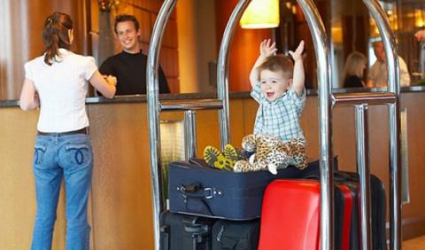 Kids and Luggage checking into Nashville Hotel 