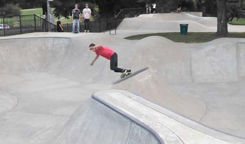 Two Rivers Outdoor Skate Park Boys Skating at Two Rivers Skate Park in Nashville Tennessee