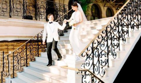 bride and groom walking down the grand staircase at Union Station Hotel