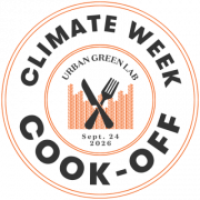 A round graphic with a crossed fork and knife over a city-scape